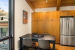  The fully equipped kitchen has stainless steel appliances and granite countertops